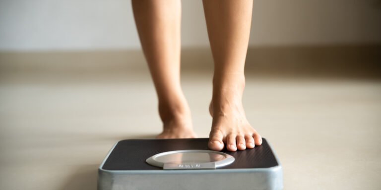 Woman checking her weight