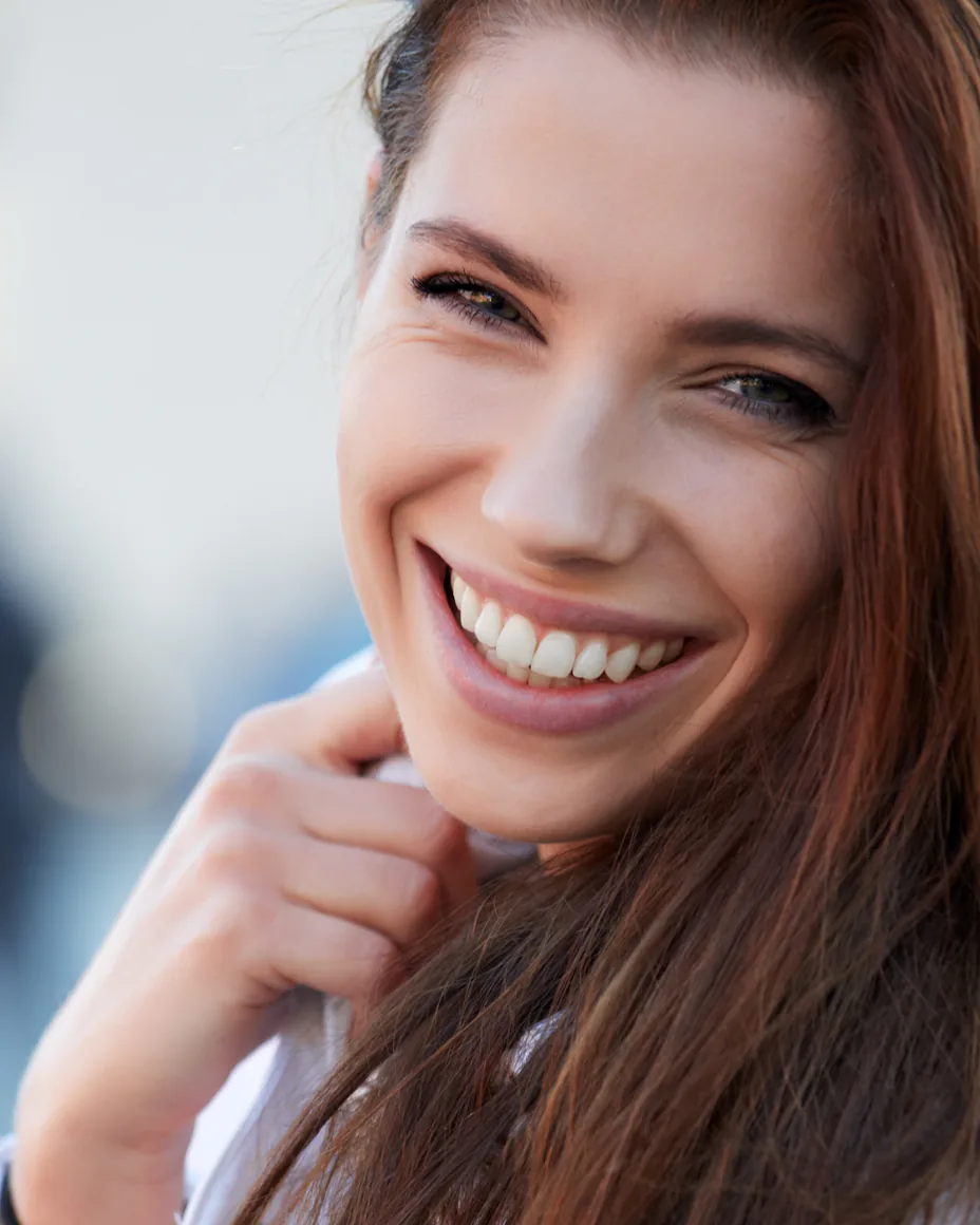 Smiling brunette wearing a winter jacket