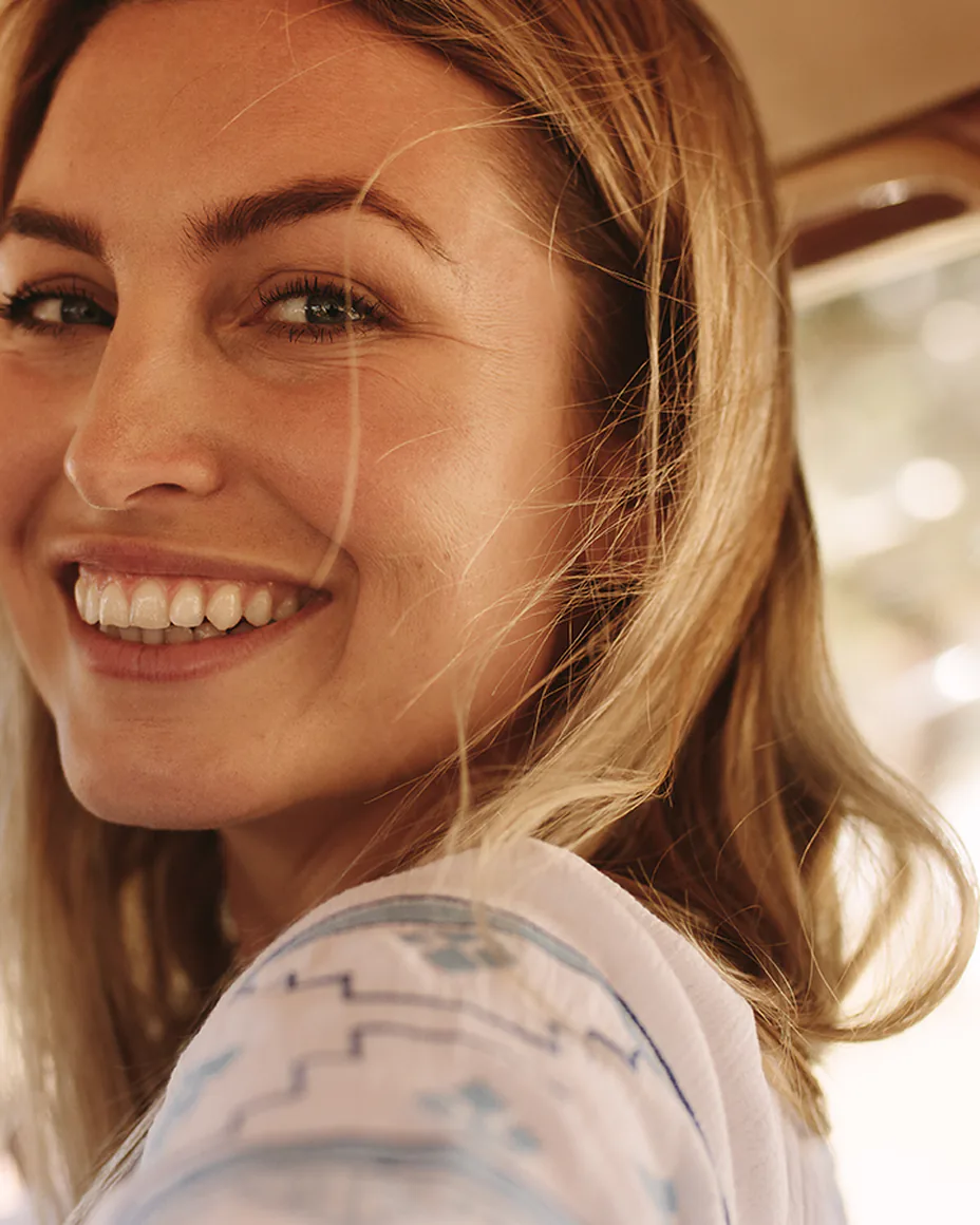 Smiling woman in a car